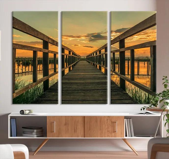 The "Sunset and Wood Bridge" triptych, printed on museum-quality canvases with a UV-protective coating, adorns the wall.