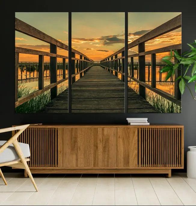 The "Sunset and Wood Bridge" triptych, printed on museum-quality canvases with a UV-protective coating, adorns the wall.