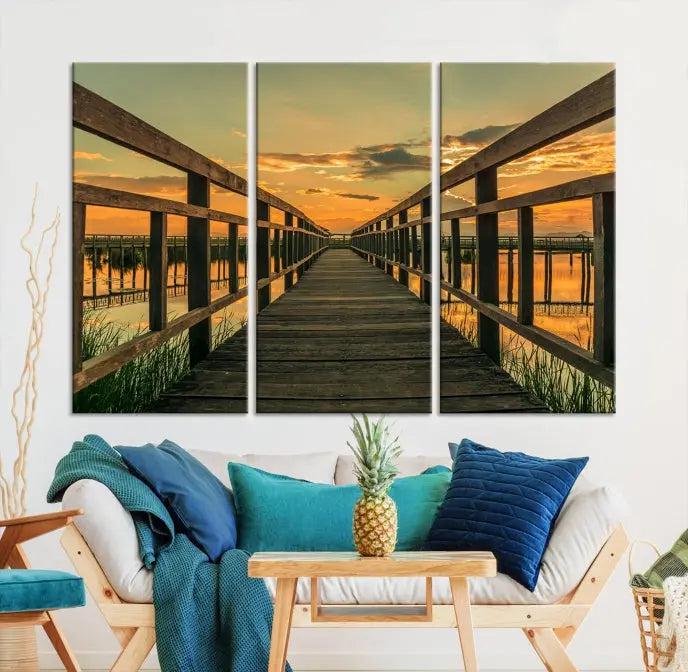 The "Sunset and Wood Bridge" triptych, printed on museum-quality canvases with a UV-protective coating, adorns the wall.