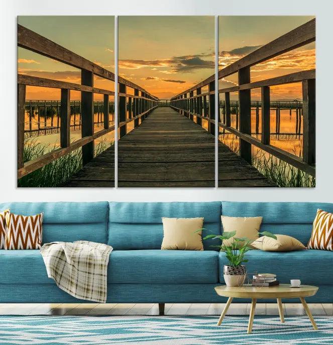 The "Sunset and Wood Bridge" triptych, printed on museum-quality canvases with a UV-protective coating, adorns the wall.