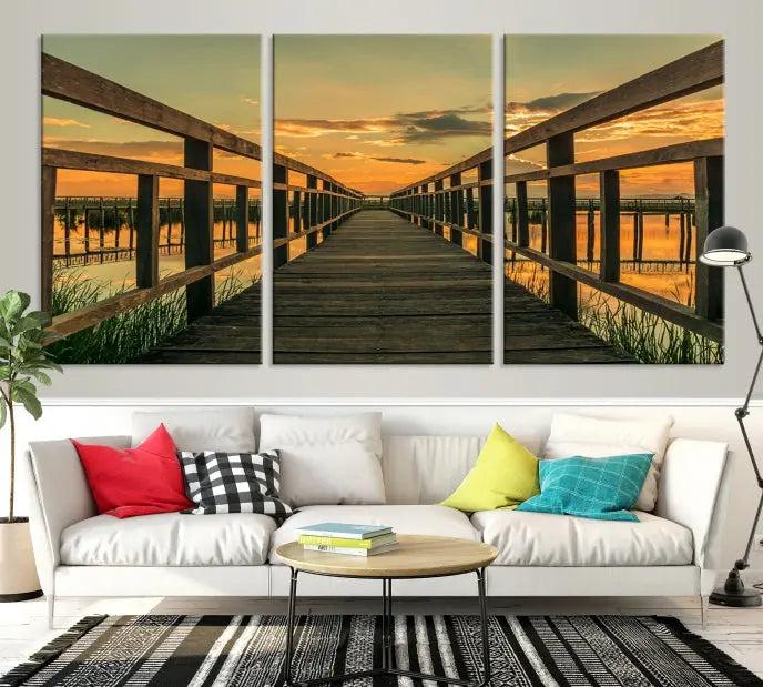 The "Sunset and Wood Bridge" triptych, printed on museum-quality canvases with a UV-protective coating, adorns the wall.