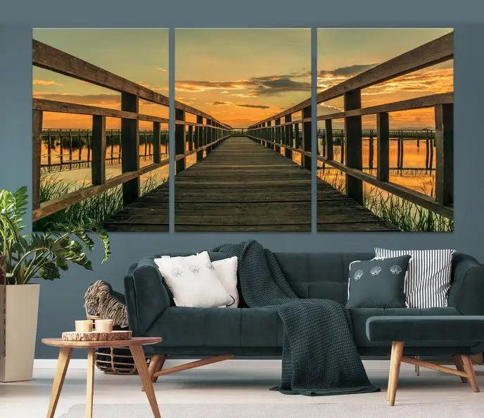 The "Sunset and Wood Bridge" triptych, printed on museum-quality canvases with a UV-protective coating, adorns the wall.