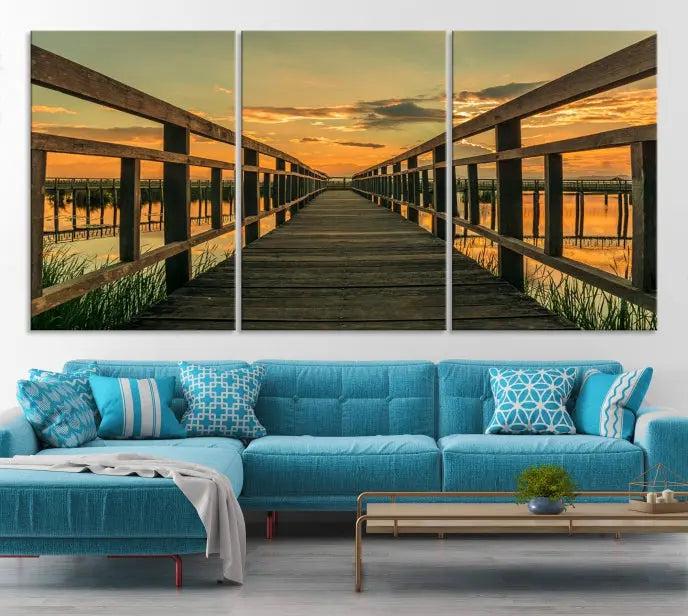 The "Sunset and Wood Bridge" triptych, printed on museum-quality canvases with a UV-protective coating, adorns the wall.