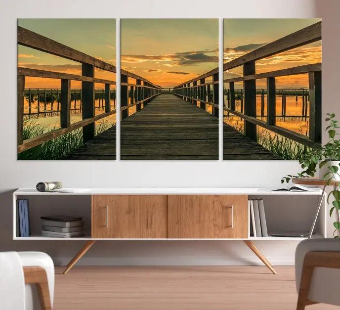 The "Sunset and Wood Bridge" triptych, printed on museum-quality canvases with a UV-protective coating, adorns the wall.