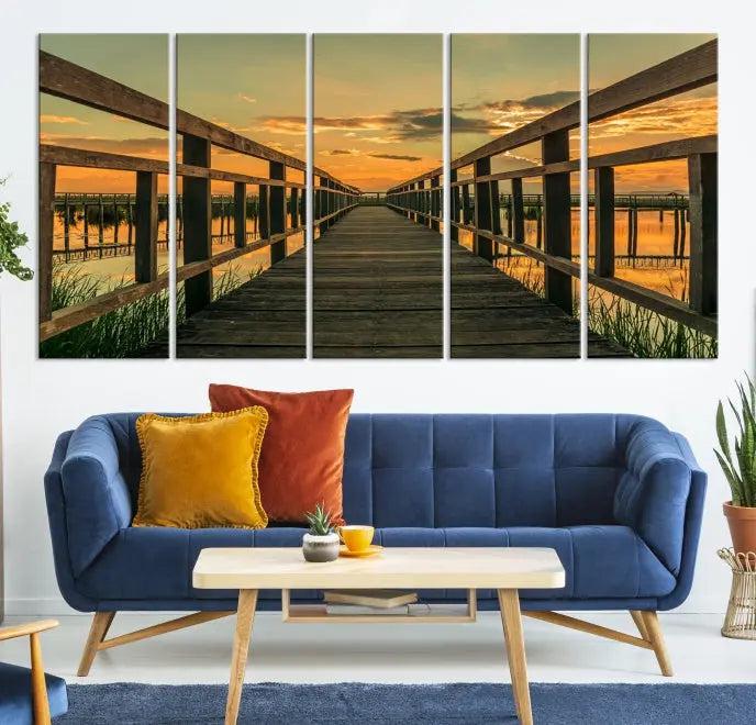 The "Sunset and Wood Bridge" triptych, printed on museum-quality canvases with a UV-protective coating, adorns the wall.