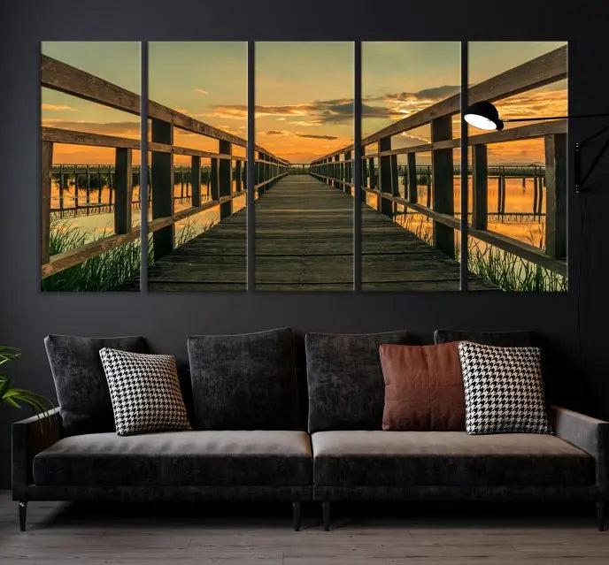 The "Sunset and Wood Bridge" triptych, printed on museum-quality canvases with a UV-protective coating, adorns the wall.