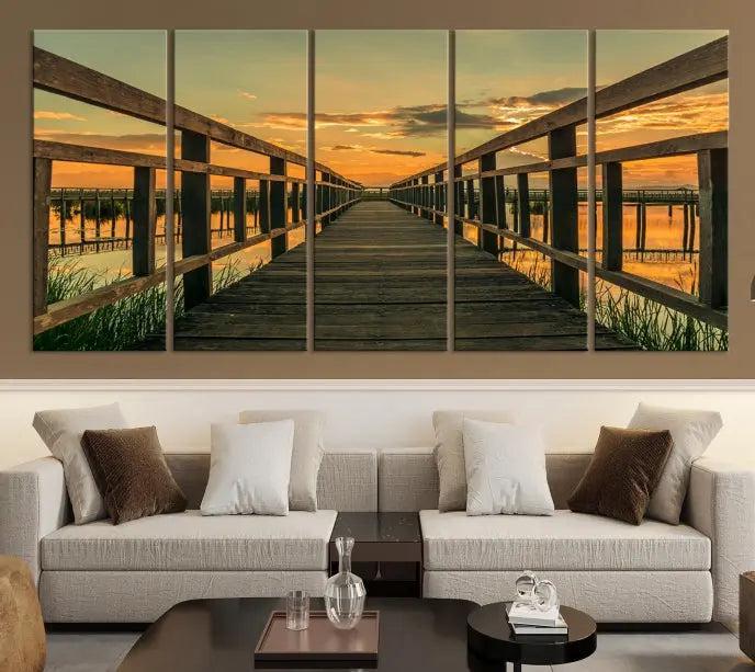 The "Sunset and Wood Bridge" triptych, printed on museum-quality canvases with a UV-protective coating, adorns the wall.