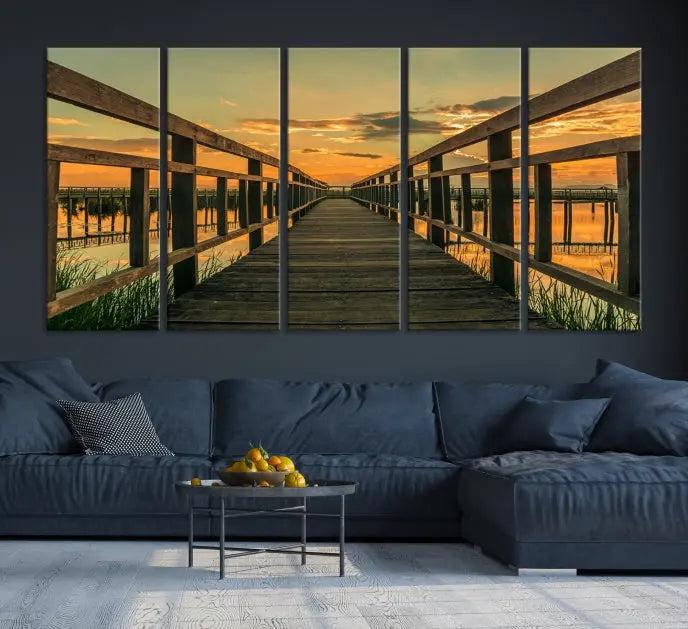 The "Sunset and Wood Bridge" triptych, printed on museum-quality canvases with a UV-protective coating, adorns the wall.