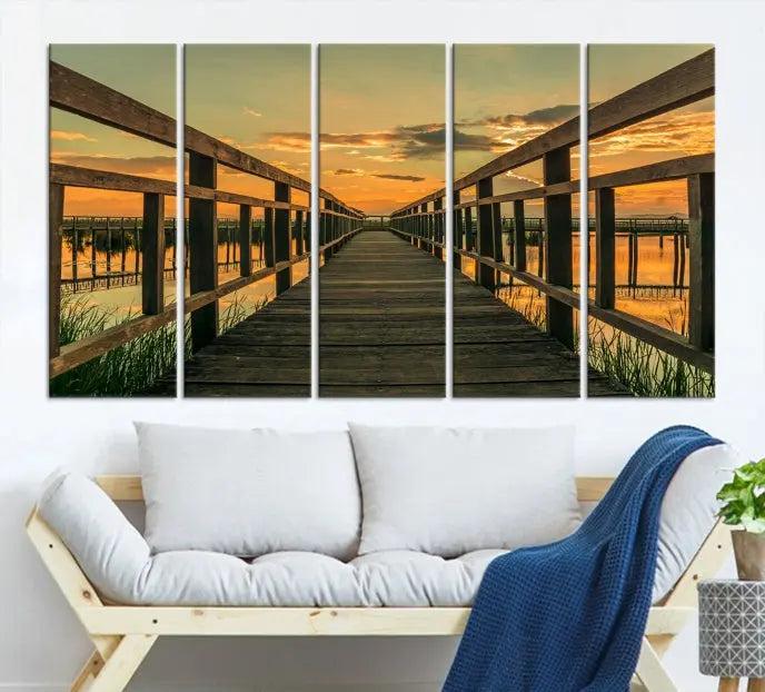 The "Sunset and Wood Bridge" triptych, printed on museum-quality canvases with a UV-protective coating, adorns the wall.