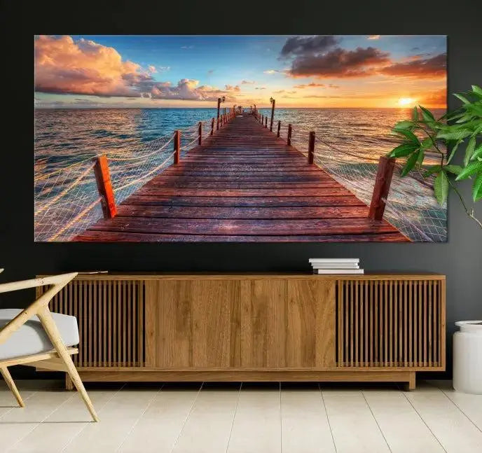 A gallery-wrapped triptych of the "Sunset and Wood Pier Wall Art Canvas Print" is expertly printed on museum-quality canvas with a UV-protective coating.