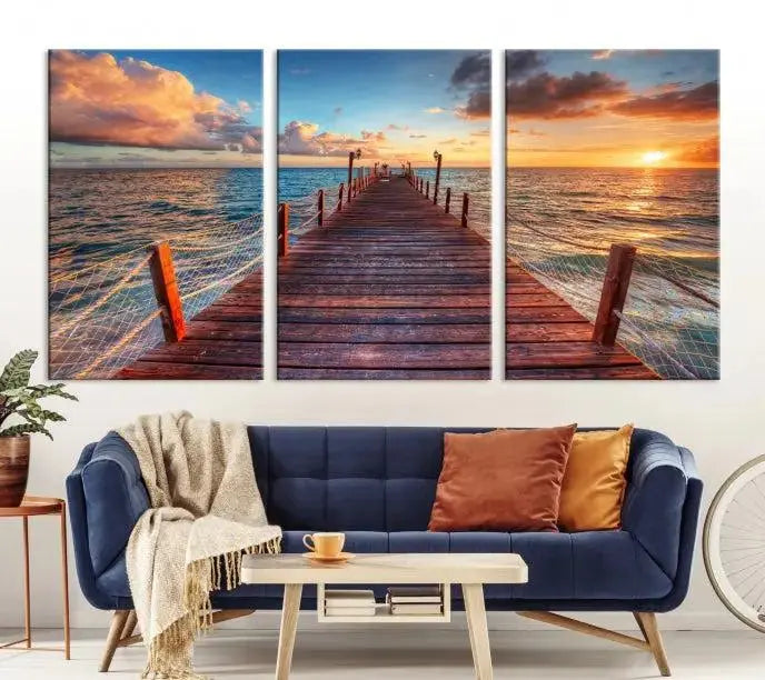 A gallery-wrapped triptych of the "Sunset and Wood Pier Wall Art Canvas Print" is expertly printed on museum-quality canvas with a UV-protective coating.