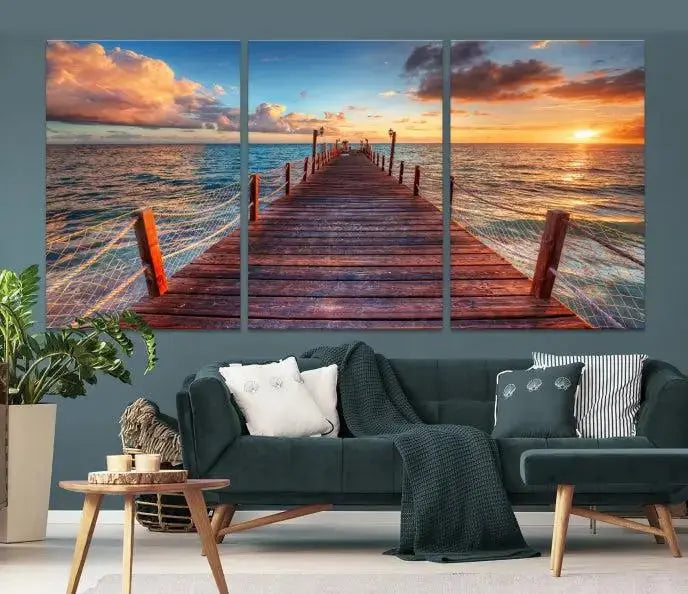 A gallery-wrapped triptych of the "Sunset and Wood Pier Wall Art Canvas Print" is expertly printed on museum-quality canvas with a UV-protective coating.