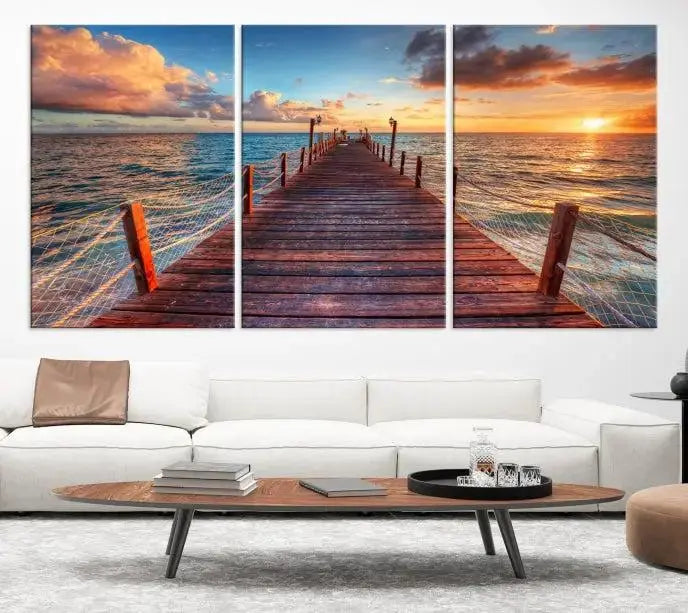 A gallery-wrapped triptych of the "Sunset and Wood Pier Wall Art Canvas Print" is expertly printed on museum-quality canvas with a UV-protective coating.