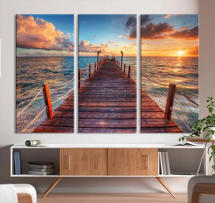 A gallery-wrapped triptych of the "Sunset and Wood Pier Wall Art Canvas Print" is expertly printed on museum-quality canvas with a UV-protective coating.