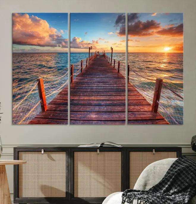 A gallery-wrapped triptych of the "Sunset and Wood Pier Wall Art Canvas Print" is expertly printed on museum-quality canvas with a UV-protective coating.