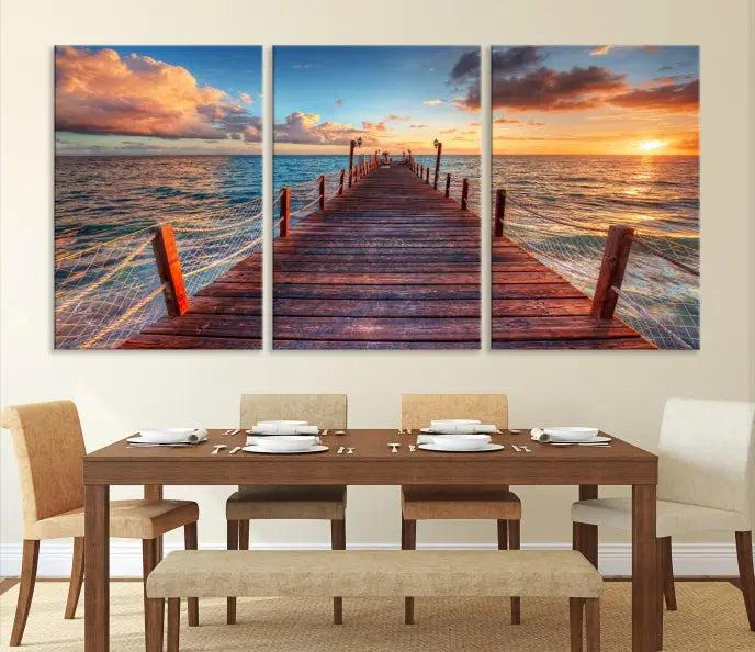 A gallery-wrapped triptych of the "Sunset and Wood Pier Wall Art Canvas Print" is expertly printed on museum-quality canvas with a UV-protective coating.