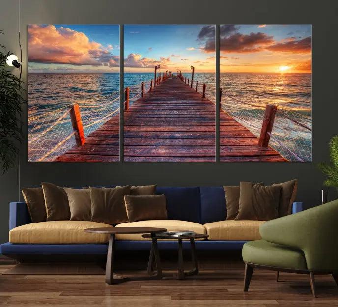 A gallery-wrapped triptych of the "Sunset and Wood Pier Wall Art Canvas Print" is expertly printed on museum-quality canvas with a UV-protective coating.