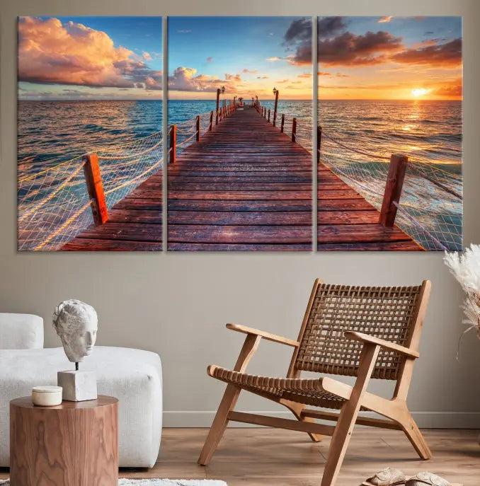 A gallery-wrapped triptych of the "Sunset and Wood Pier Wall Art Canvas Print" is expertly printed on museum-quality canvas with a UV-protective coating.