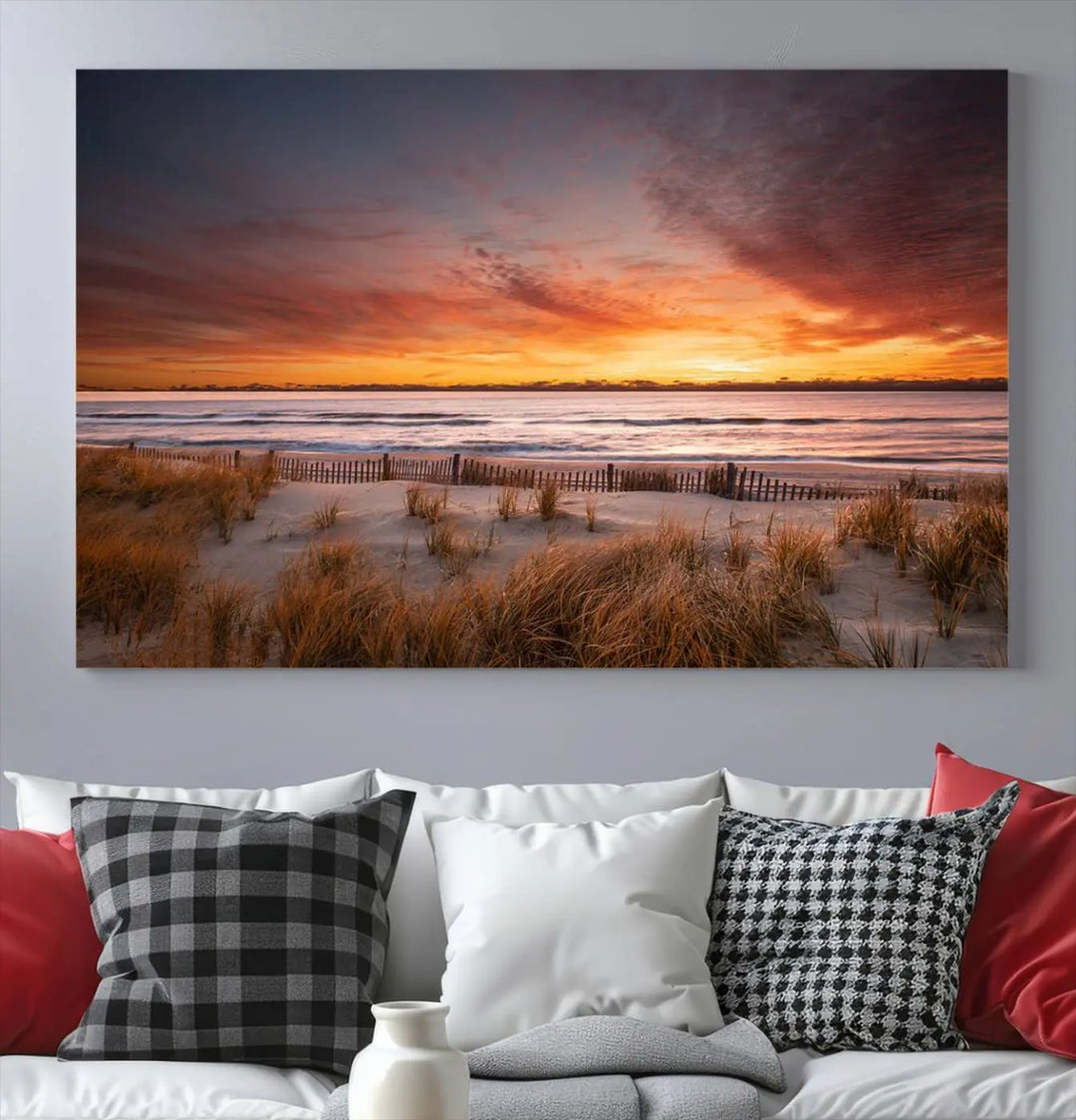 Sunset on The Beach Wall Art Canvas Print features a triptych of a beach at sunset with vivid orange skies, presented on museum-quality canvas. Each section is gallery wrapped, offering lasting beauty with its UV-protective coating.