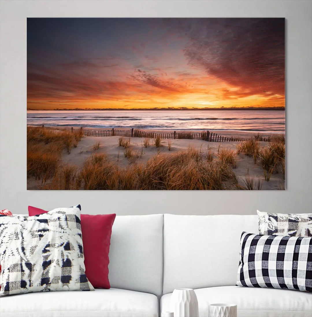 Sunset on The Beach Wall Art Canvas Print features a triptych of a beach at sunset with vivid orange skies, presented on museum-quality canvas. Each section is gallery wrapped, offering lasting beauty with its UV-protective coating.