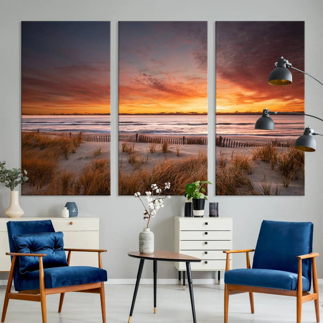 Sunset on The Beach Wall Art Canvas Print features a triptych of a beach at sunset with vivid orange skies, presented on museum-quality canvas. Each section is gallery wrapped, offering lasting beauty with its UV-protective coating.