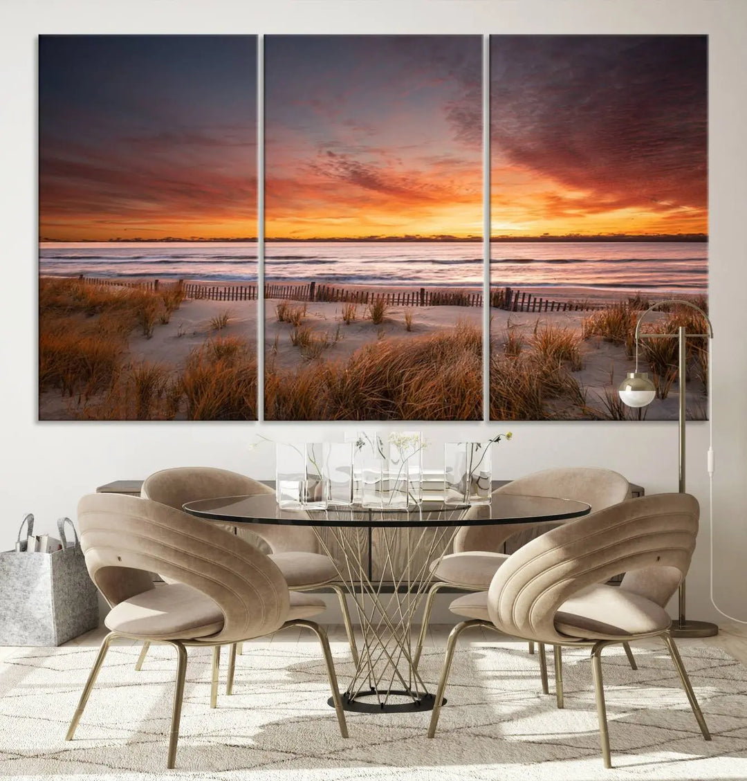 Sunset on The Beach Wall Art Canvas Print features a triptych of a beach at sunset with vivid orange skies, presented on museum-quality canvas. Each section is gallery wrapped, offering lasting beauty with its UV-protective coating.