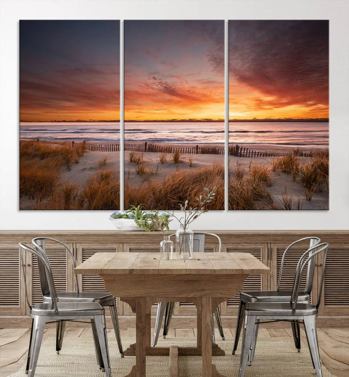 Sunset on The Beach Wall Art Canvas Print features a triptych of a beach at sunset with vivid orange skies, presented on museum-quality canvas. Each section is gallery wrapped, offering lasting beauty with its UV-protective coating.