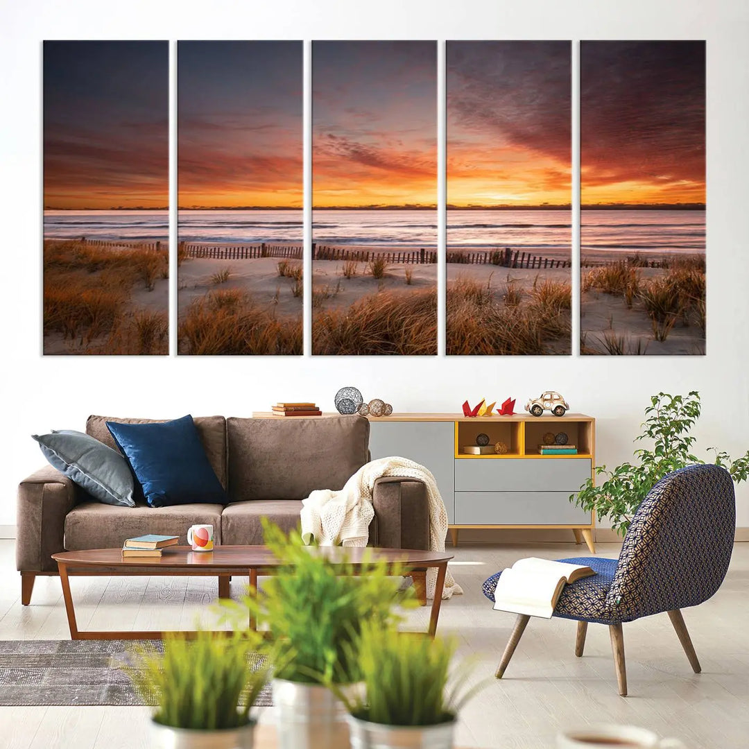 Sunset on The Beach Wall Art Canvas Print features a triptych of a beach at sunset with vivid orange skies, presented on museum-quality canvas. Each section is gallery wrapped, offering lasting beauty with its UV-protective coating.