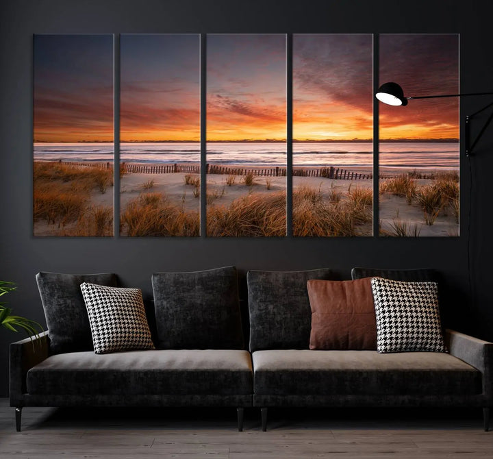 Sunset on The Beach Wall Art Canvas Print features a triptych of a beach at sunset with vivid orange skies, presented on museum-quality canvas. Each section is gallery wrapped, offering lasting beauty with its UV-protective coating.