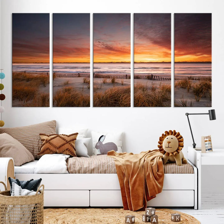 Sunset on The Beach Wall Art Canvas Print features a triptych of a beach at sunset with vivid orange skies, presented on museum-quality canvas. Each section is gallery wrapped, offering lasting beauty with its UV-protective coating.