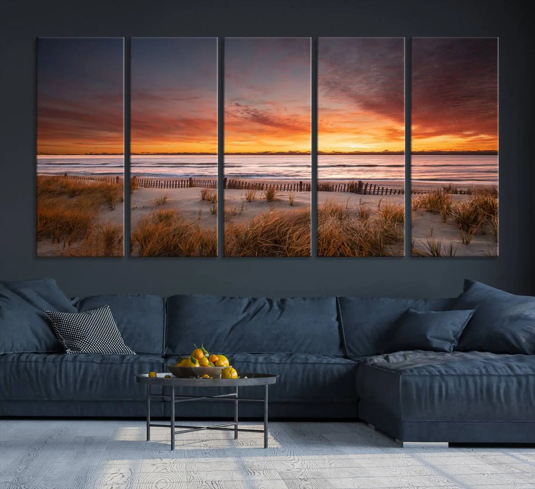 Sunset on The Beach Wall Art Canvas Print features a triptych of a beach at sunset with vivid orange skies, presented on museum-quality canvas. Each section is gallery wrapped, offering lasting beauty with its UV-protective coating.