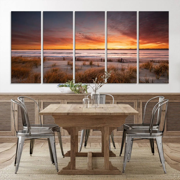 Sunset on The Beach Wall Art Canvas Print features a triptych of a beach at sunset with vivid orange skies, presented on museum-quality canvas. Each section is gallery wrapped, offering lasting beauty with its UV-protective coating.