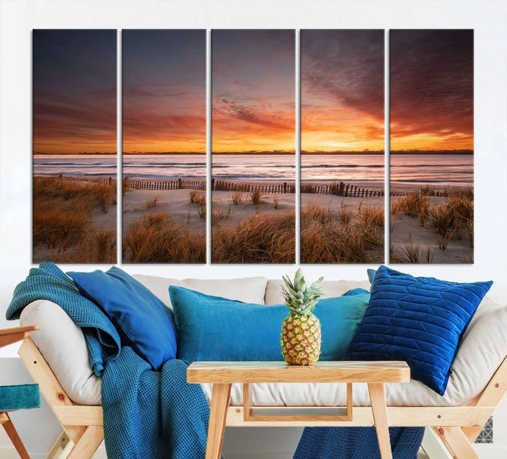 Sunset on The Beach Wall Art Canvas Print features a triptych of a beach at sunset with vivid orange skies, presented on museum-quality canvas. Each section is gallery wrapped, offering lasting beauty with its UV-protective coating.