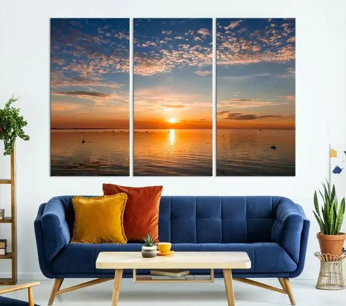 The "Sunset on the Sea Wall Art Canvas Print" graces the space as a stunning triptych, with its museum-quality canvas showcasing a serene sunset over water. The gallery-wrapped edges enhance depth and elegance, creating an ideal centerpiece for any room.