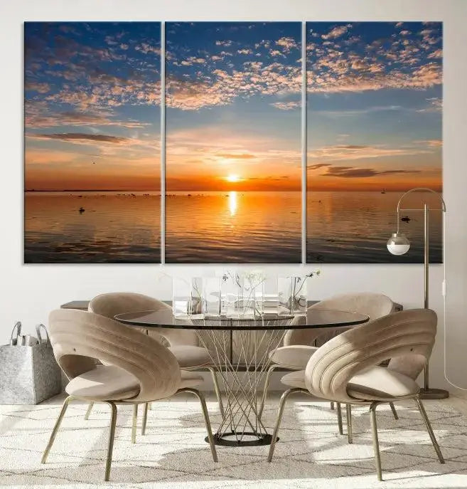 The "Sunset on the Sea Wall Art Canvas Print" graces the space as a stunning triptych, with its museum-quality canvas showcasing a serene sunset over water. The gallery-wrapped edges enhance depth and elegance, creating an ideal centerpiece for any room.