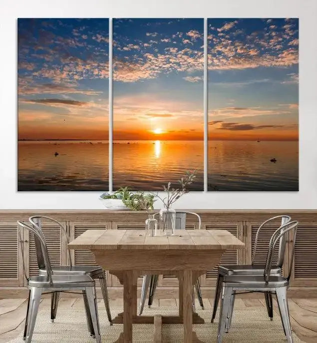 The "Sunset on the Sea Wall Art Canvas Print" graces the space as a stunning triptych, with its museum-quality canvas showcasing a serene sunset over water. The gallery-wrapped edges enhance depth and elegance, creating an ideal centerpiece for any room.