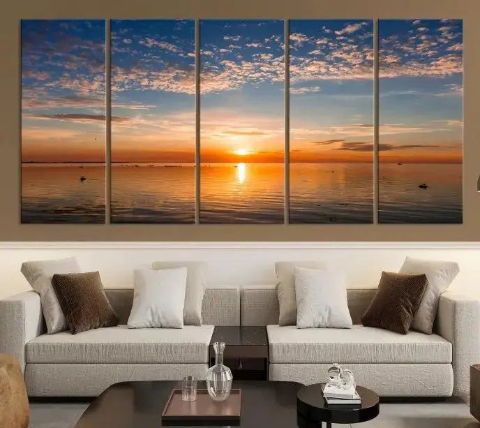 The "Sunset on the Sea Wall Art Canvas Print" graces the space as a stunning triptych, with its museum-quality canvas showcasing a serene sunset over water. The gallery-wrapped edges enhance depth and elegance, creating an ideal centerpiece for any room.