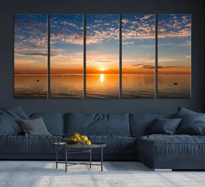 The "Sunset on the Sea Wall Art Canvas Print" graces the space as a stunning triptych, with its museum-quality canvas showcasing a serene sunset over water. The gallery-wrapped edges enhance depth and elegance, creating an ideal centerpiece for any room.