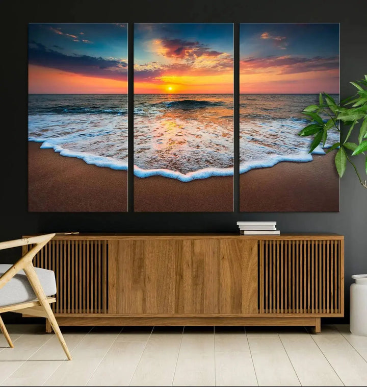 The "Sunset with Calm Waves on the Beach" wall art canvas print, featuring a colorful sunset over the ocean and designed with a UV-protective coating for museum-quality preservation, is prominently displayed.