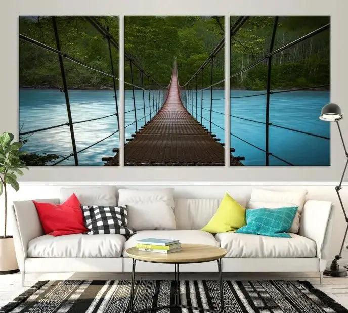 A breathtaking 3-panel nature photography piece titled "Suspension Bridge Over River Canvas Art" beautifully enhances the living room wall, adding an exquisite touch of scenic wall art.