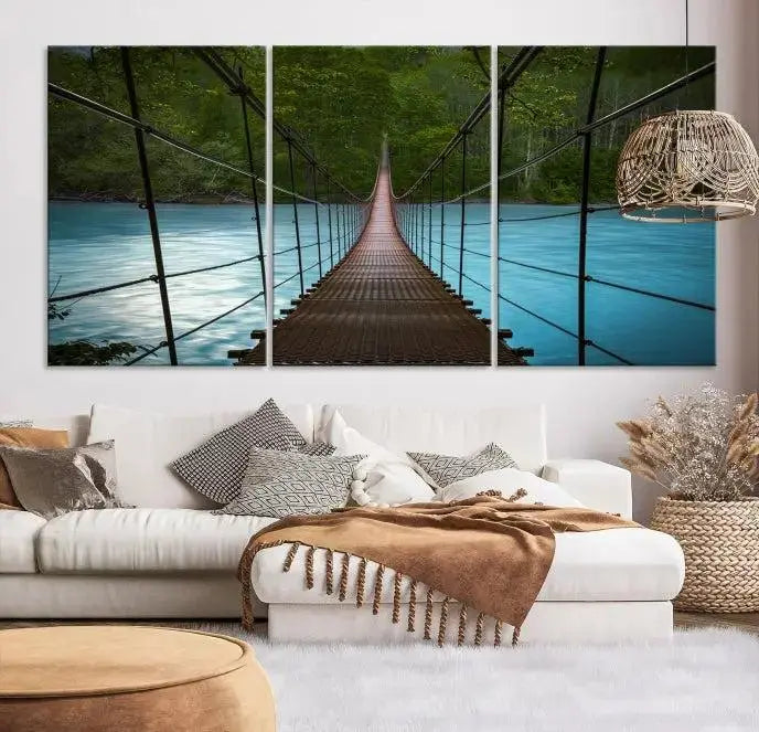 A breathtaking 3-panel nature photography piece titled "Suspension Bridge Over River Canvas Art" beautifully enhances the living room wall, adding an exquisite touch of scenic wall art.