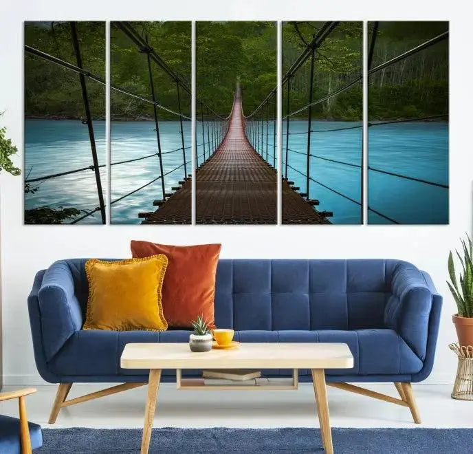 A breathtaking 3-panel nature photography piece titled "Suspension Bridge Over River Canvas Art" beautifully enhances the living room wall, adding an exquisite touch of scenic wall art.