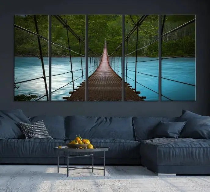 A breathtaking 3-panel nature photography piece titled "Suspension Bridge Over River Canvas Art" beautifully enhances the living room wall, adding an exquisite touch of scenic wall art.