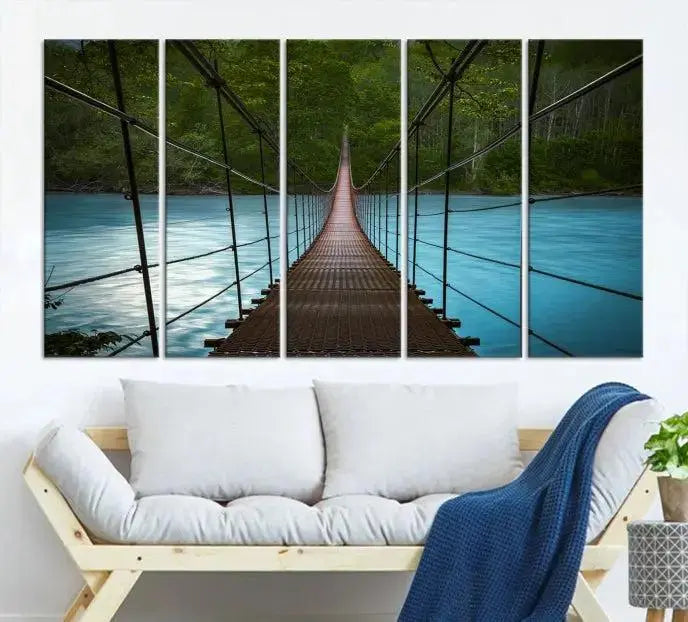 A breathtaking 3-panel nature photography piece titled "Suspension Bridge Over River Canvas Art" beautifully enhances the living room wall, adding an exquisite touch of scenic wall art.