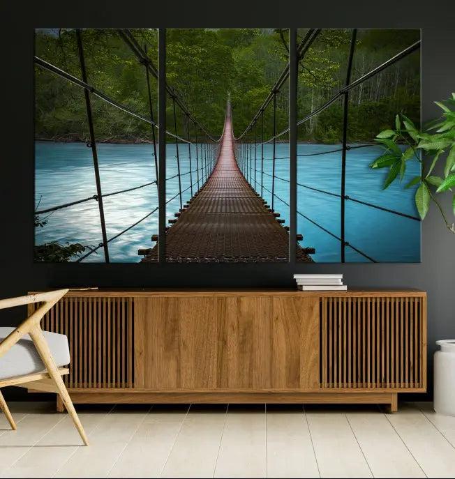 A breathtaking 3-panel nature photography piece titled "Suspension Bridge Over River Canvas Art" beautifully enhances the living room wall, adding an exquisite touch of scenic wall art.