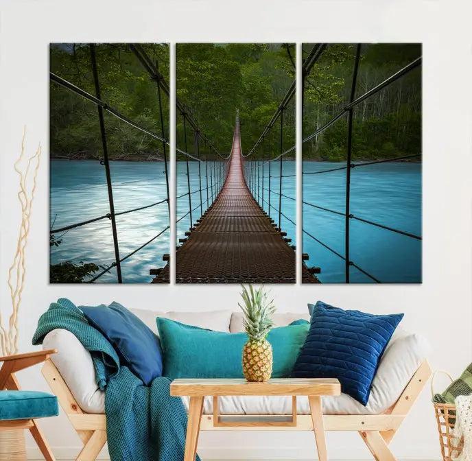 A breathtaking 3-panel nature photography piece titled "Suspension Bridge Over River Canvas Art" beautifully enhances the living room wall, adding an exquisite touch of scenic wall art.