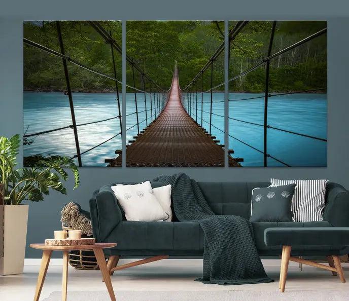 A breathtaking 3-panel nature photography piece titled "Suspension Bridge Over River Canvas Art" beautifully enhances the living room wall, adding an exquisite touch of scenic wall art.