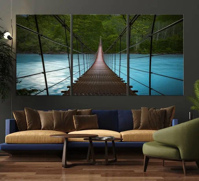 A breathtaking 3-panel nature photography piece titled "Suspension Bridge Over River Canvas Art" beautifully enhances the living room wall, adding an exquisite touch of scenic wall art.