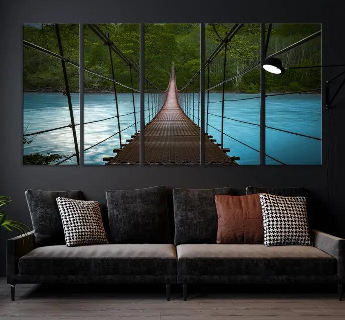 A breathtaking 3-panel nature photography piece titled "Suspension Bridge Over River Canvas Art" beautifully enhances the living room wall, adding an exquisite touch of scenic wall art.