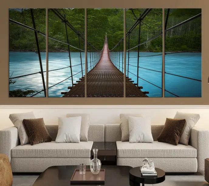 A breathtaking 3-panel nature photography piece titled "Suspension Bridge Over River Canvas Art" beautifully enhances the living room wall, adding an exquisite touch of scenic wall art.